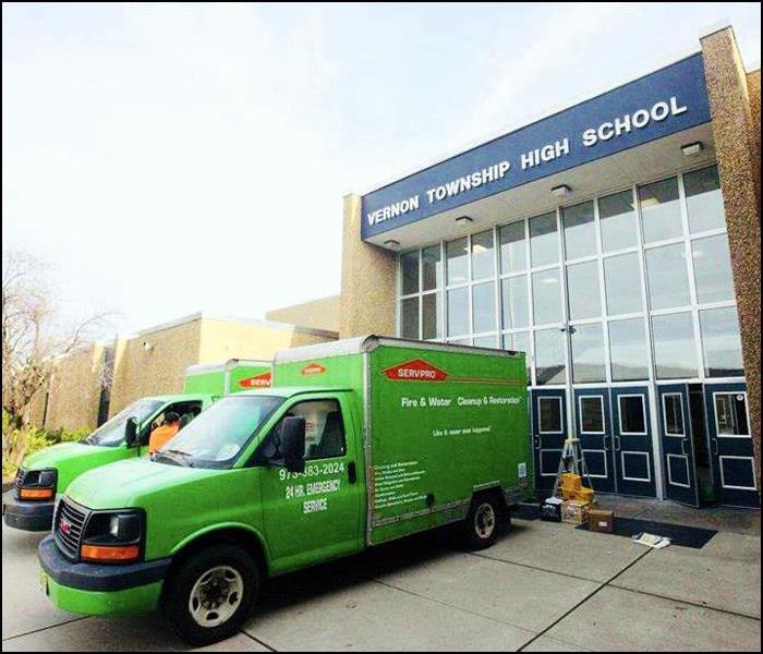 SERVPRO trucks in front of a high school