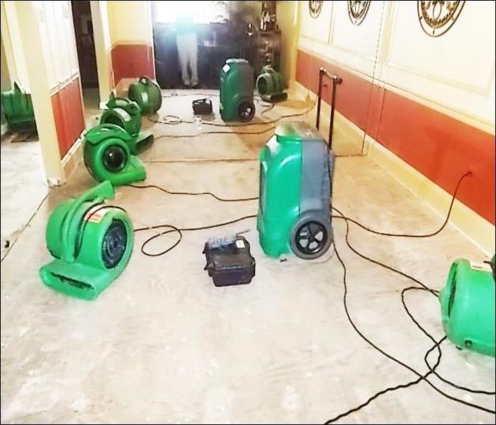 SERVPRO equipment on the floor of a water damaged home