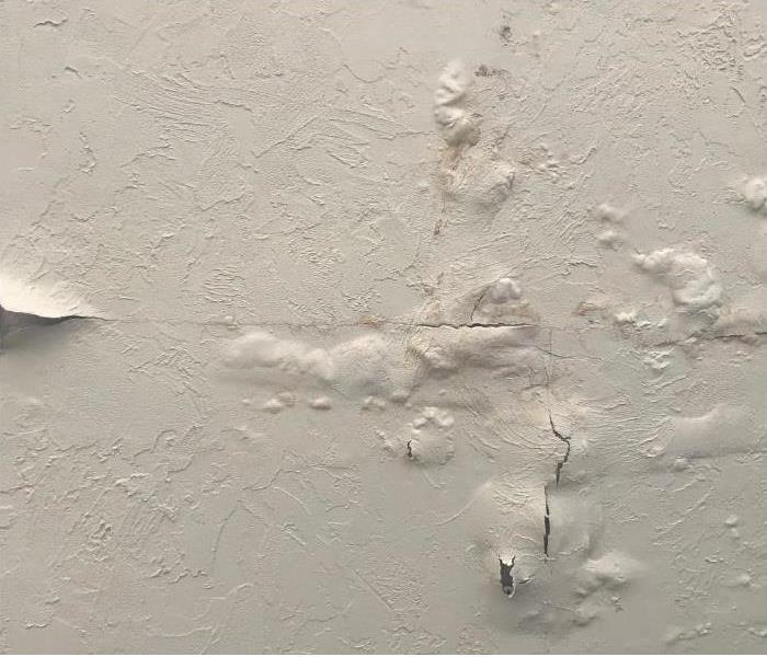 paint bubbling on a water damaged wall